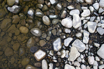 stones on the river bank close up