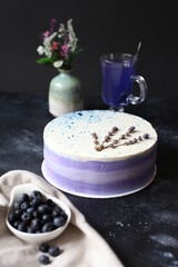 blueberry lavender cake on dark background