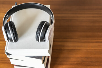 Books with headphone. Audio book concept.