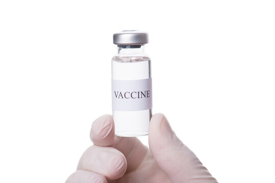 Infectious medicine concept. Close-up cropped macro photo of doctor holding a vial of vaccine isolated on white background