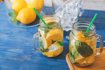 Mason jars of fresh lemonade on table