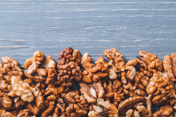 Tasty walnuts on wooden background
