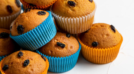 Heap of delicious raisin muffins, close-up