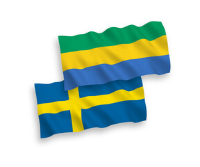 Flags of Sweden and Gabon on a white background