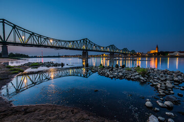 bridge over Vistula river in early misty morning. Wloclawek, Poland