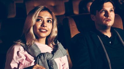 People audience watching movie in the movie theater cinema. Group recreation activity and...