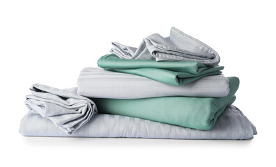 Stack of clean bed sheets on white background