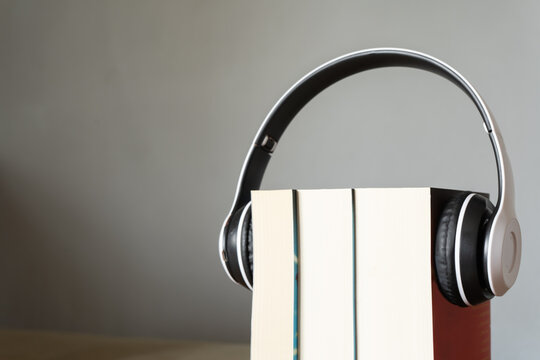 Books with headphone. Audio book concept.