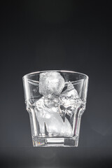 Empty glass on black background, copy space