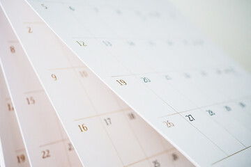 Calendar page flipping sheet close up blur background business schedule planning appointment...