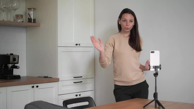 Young millennial woman dancing tiktok challenge at home during quarantine