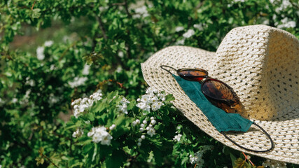 Staycations, hyper-local travel, family outing, new normal concept. Straw hat, sunglasses and...