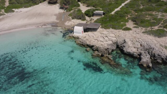 Beautiful Binebeca Beach During The Coronavirus With Binibeca Vell On The Background In Menorca, Spain. - aerial drone