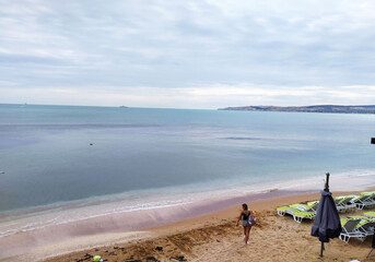 View from the boathouse to the beach and sea in the Crimea in Theodosius Bay