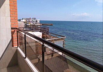 View from the boathouse to the beach and sea in the Crimea in Theodosius Bay