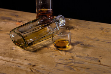 glass of whiskey and bottle