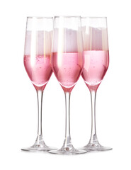 Glasses of tasty champagne on white background