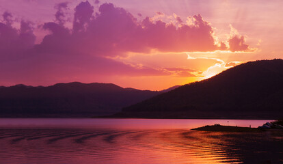 Colorful sky and colorful water in lake reflected in evening 
