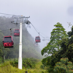 In a ropeway cable car going up from kualampur to genting highlands, Sky view and chin swee caves...