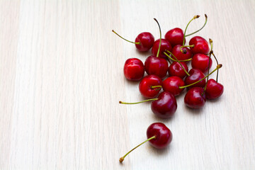 Obraz na płótnie Canvas juicy sweet cherry berries, on a white tree background