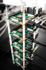 Cluster of Raspberry Pi 4 board. The Raspberry Pi is a credit-card-sized single-board computer. Conencted together as a cluster they can produce as much computation as a single laptop. - obrazy, fototapety, plakaty