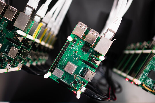 Cluster of Raspberry Pi 4 board. The Raspberry Pi is a credit-card-sized single-board computer. Conencted together as a cluster they can produce as much computation as a single laptop.