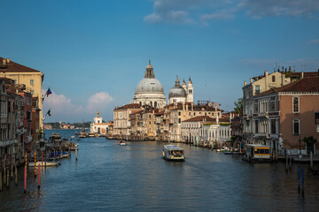 Beautiful view of famous Canal Grande and Basilica di Santa Maria della Salute in daylight, Venice, Italy