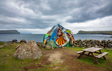 Eldgos and frumskogur the boulder covered with clothes in Sandoy island