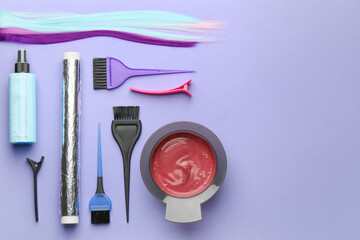 Supplies for hair coloring on color background