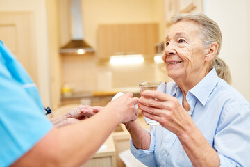 Senior as a patient gets medicine