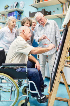 Group Of Seniors In A Painting Therapy