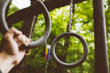 Gymnastic rings. Workout in the park.