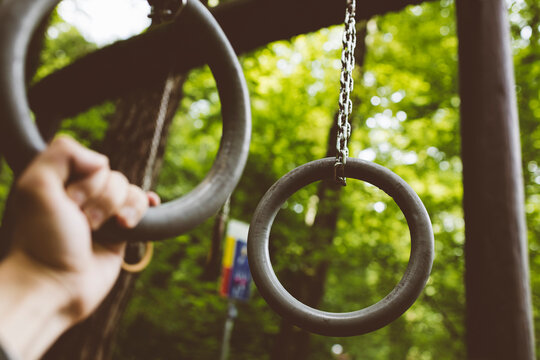 Gymnastic rings. Workout in the park.