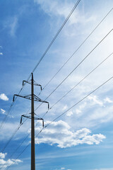 Fototapeta premium high-voltage electric line against a bright beautiful sky