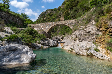 Arch bridge in mountains, Nervia valley, Ligurian Alps, Rocchetta Nervina municipality, Province of Imperia, Italy