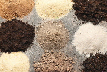Different types of soil on grey background