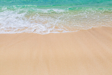 Fototapeta na wymiar Waves Lapping a Sandy Beach