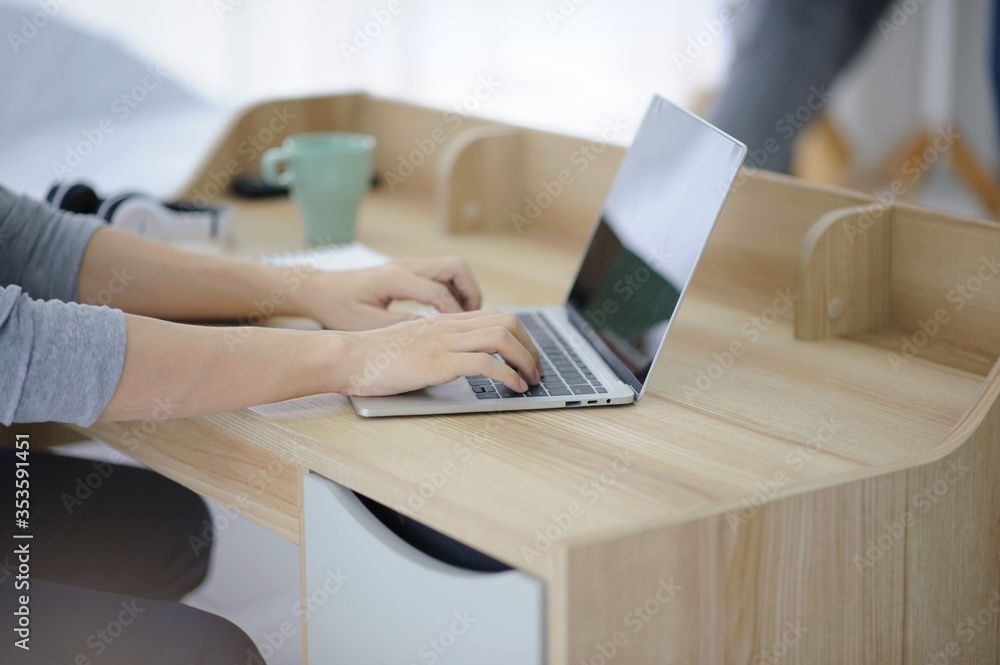 Poster new normal man using laptop computer working at home,businessman typing computer keyboard