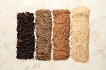 Different types of soil on light background