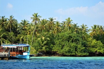 amazing view of fishing boat and landscape of tropical island of Maldives