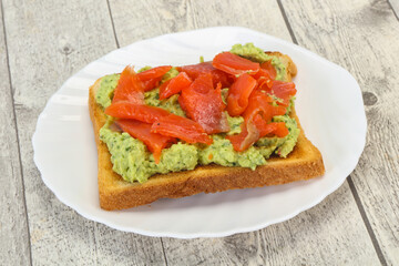Toast with guacamole and salmon