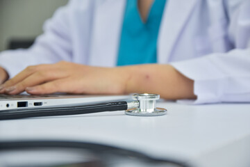 Stethoscope doctor checking heart on table