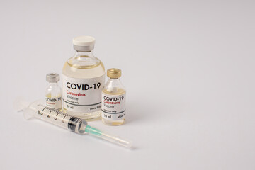 Coronavirus vaccine glass bottles on white background. Covid-19 medicine vaccination equipment. Research of coronavirus vaccine world pandemic concept.