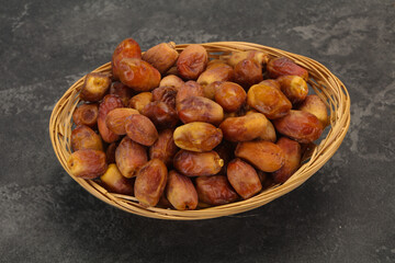 Sweet tasty dry dates in the basket