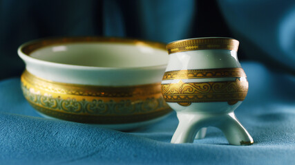 
dishes with a golden pattern