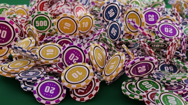 A lot of casino chips fall on the green casino table. Big win. 4K 3D animation.