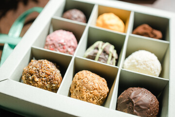 colored truffle candies in a gift box