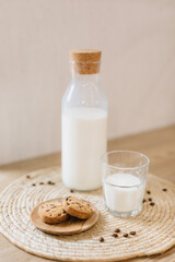 cookies and milk in a glass bottle