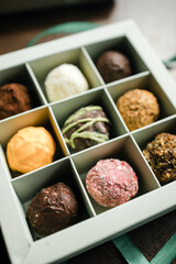 colored truffle candies in a gift box