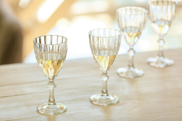 Glasses of tasty champagne on table